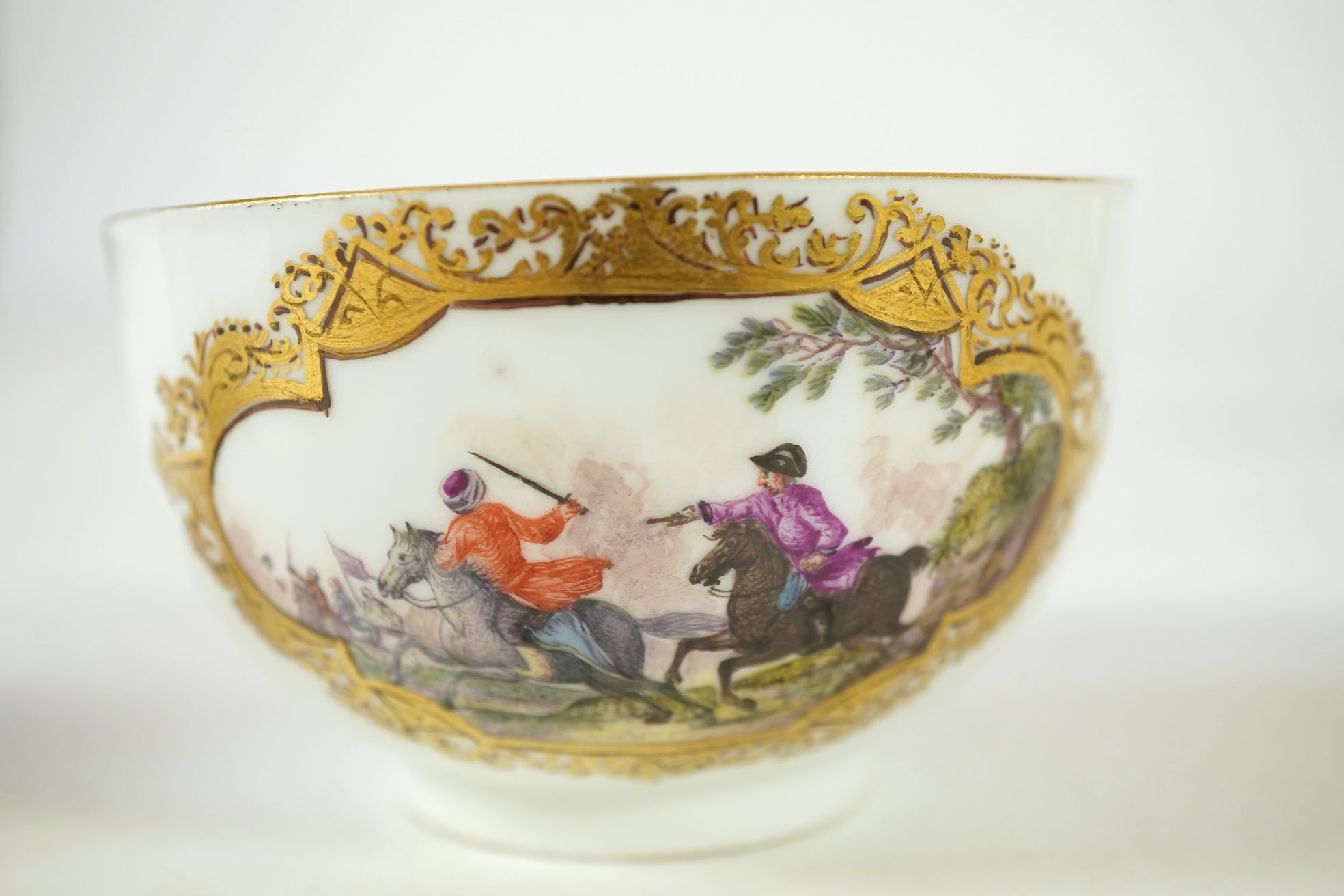 A Meissen cup and saucer, similar tea bowl and two saucers, c.1735-45